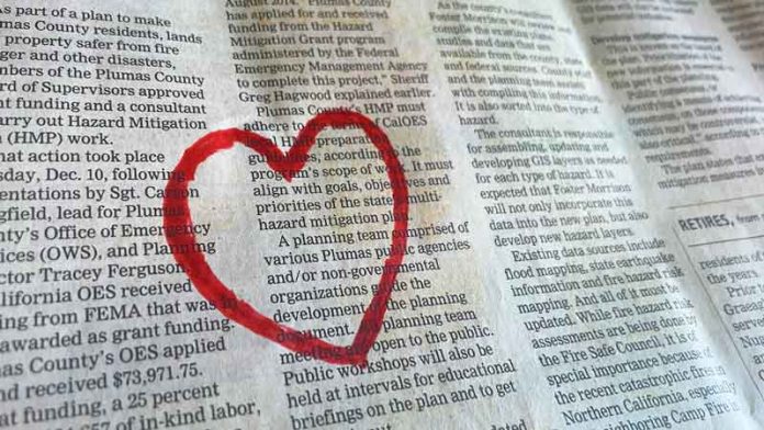 Image of heart on newspaper