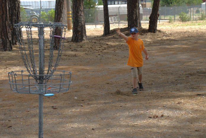 A young disc golf player competes in a recent tournament. A new proposed disc golf course is currently being analyzed by Plumas National Forest. Photos courtesy Plumas Disc Golf