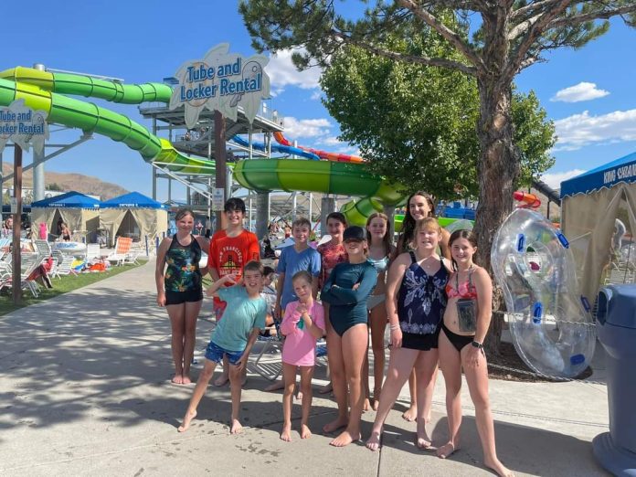 Sierra Valley 4-H members visit the waterpark in Reno. Back, left to right: Callie Steffanic, Ryker Osburn, Triptyn Pierson, Izzabella Ceresola, Hayden Fisher, and Aurora Osburn. Front, left to right: Keevan Pierson, Abbie McGarr, Rylie McGarr, Gracie McGarr, and Jolie Fisher. Photo courtesy Sierra Valley 4-H