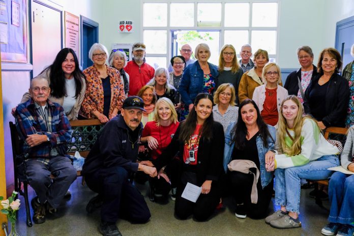 Estelle Beer’s family, including her husband Milton Beer (far left), daughters Annika Beer (second from left) and Alicia Beer Doyle (second from right front), and granddaughter Kellyn Wagner (seated far right), join many current and former Quincy Elementary School staffers for the celebration of her life and legacy. Photos by Cary Dingel / Plumas Unified School District