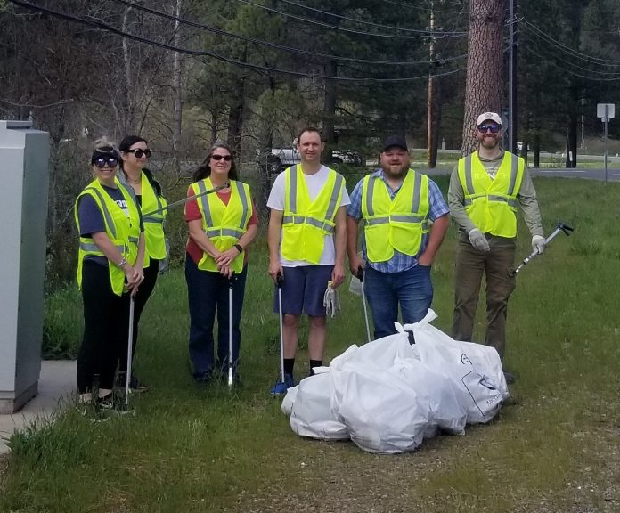 Members of the district attorney's office staff pick up trash along the roadway. From left: Jessica Beatley, Nicole Romero, Kathy Green, Ian Thompson, Shawn Adams and Brian Hagen. Photo by David Hollister