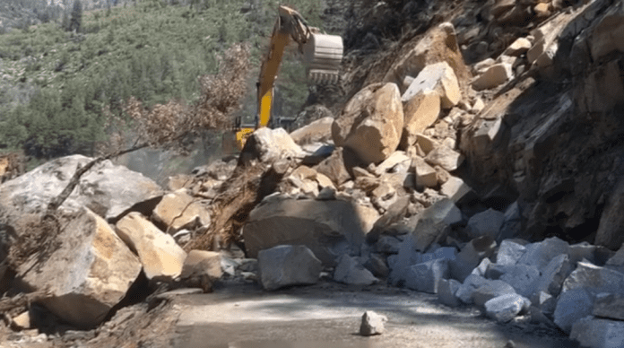 Efforts are underway to clear the slide on State Route 70 in the Feather River Canyon near Cresta. Still from video by Matt Martin / courtesy Caltrans District 2